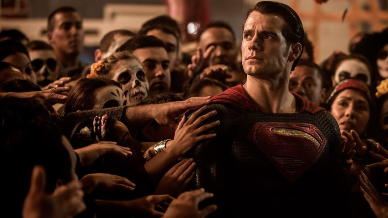 Superman is grabbed by adoring fans