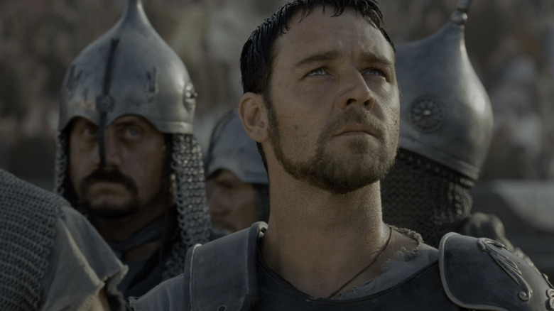 Maximus looks up at the crowds of ancient rome in Gladiator