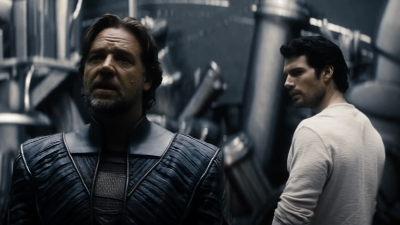 Jor-El looks into the distance as his son, Kal-El, watches from behind in Man of Steel