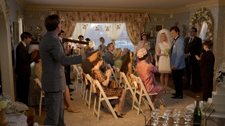 A family gathered in a living room in the movie Here