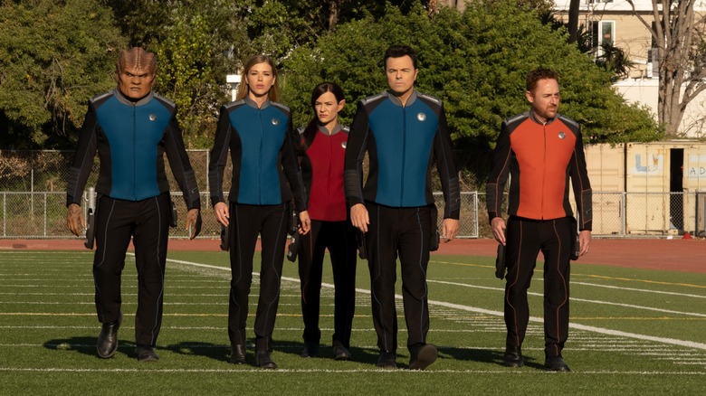 A landing party from the Orville prepare to face a bully on a football field in "The Orville: New Horizons"