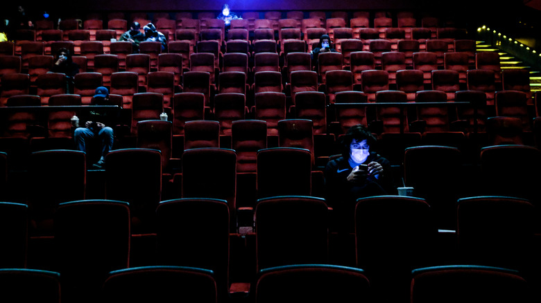 Socially distanced audience of an AMC theater