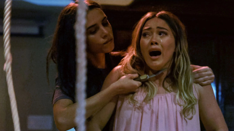 Patricia holding a knife to Sharon's throat in The Haunting of Sharon Tate