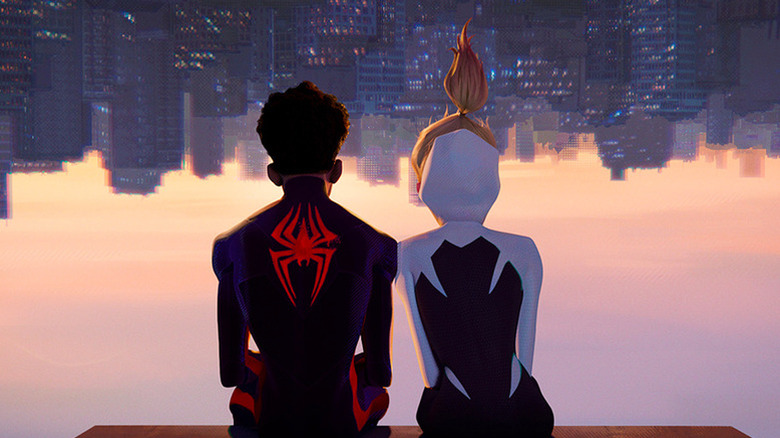 Miles and Gwen look at the sunset together while sitting upside-down in Spider-Man: Across the Spider-Verse