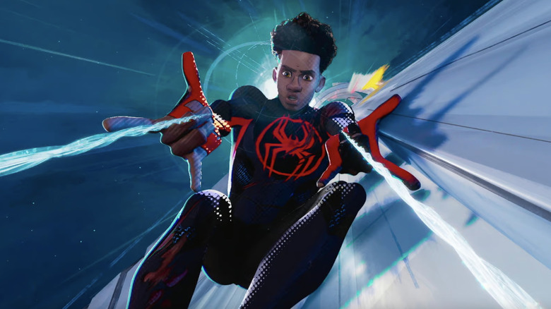 Miles Morales throws his spider-web to launch himself in Spider-Man: Across the Spider-Vers