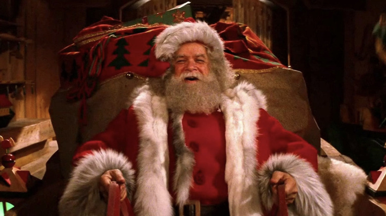 David Huddleston as Santa Claus in his sleigh in Santa Claus: The Movie