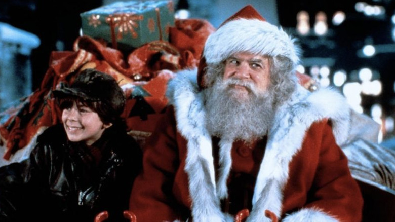 Christian L. Fitzpatrick as Joe and David Huddleston as Santa Claus in his sleigh ready to deliver gifts in Santa Claus: The Movie