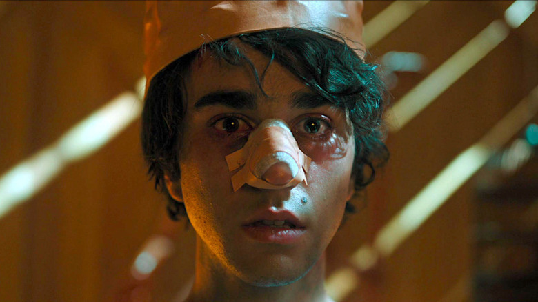 Alex Wolff with crown and nose bandage in Hereditary