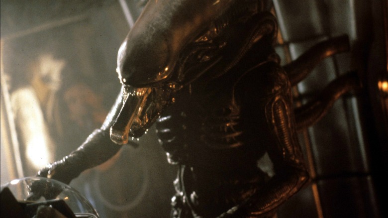 The xenomorph extends its smaller jaw in Alien