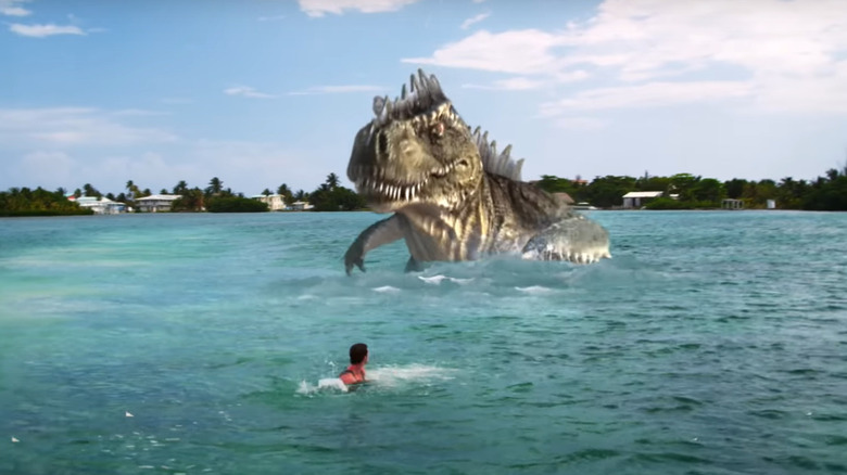 Dinosaur chasing man in ocean