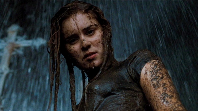 Alison Lohman standing in the rain