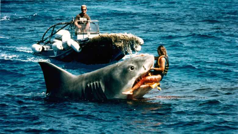 Shark with woman in its jaws 