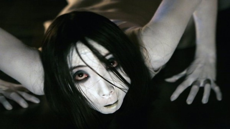 Kayako crawling on the ground