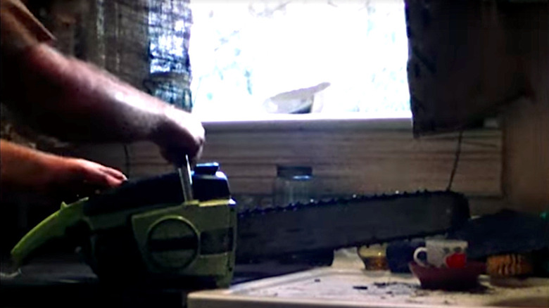 The chainsaw sits on the counter in "The Texas Chain Saw Massacre"