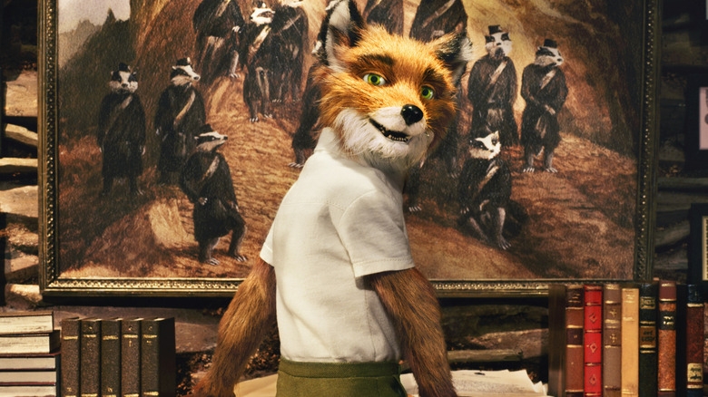 Mr. Fox standing in front of a painting and bookshelf in Fantastic Mr. Fox