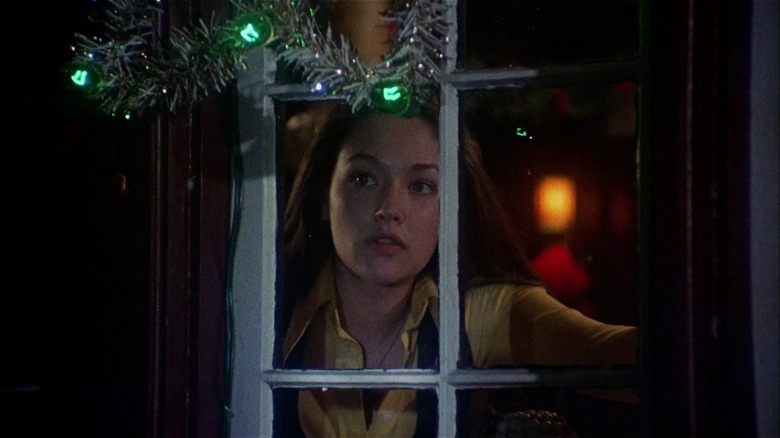 Jess looking outside the window in Black Christmas