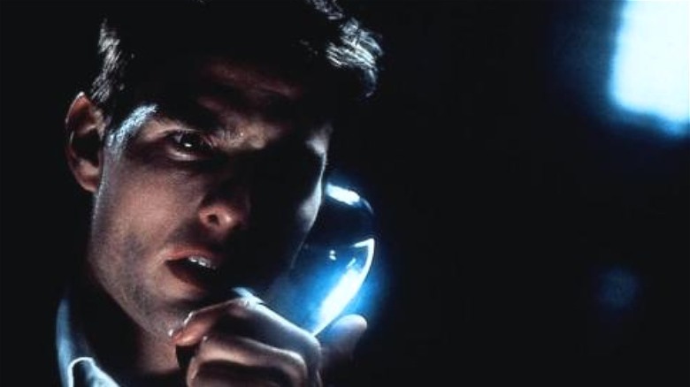 Tom Cruise takes a call in Mission: Impossible