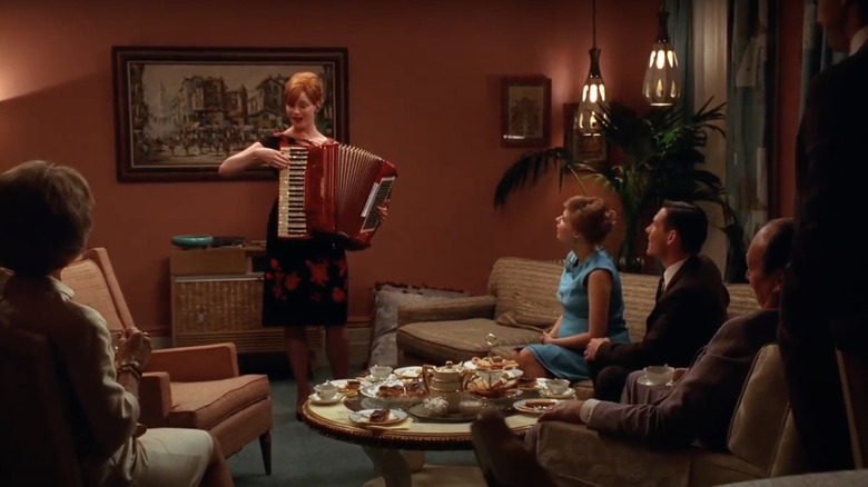 Joan Holloway playing the accordion in Mad Men