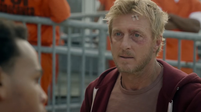 Johnny Lawrence looking bruised and battered in Cobra Kai