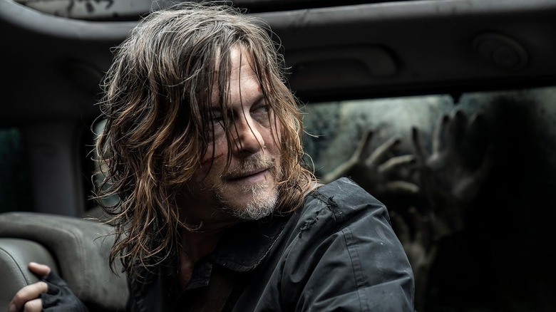 Norman Reedus' Daryl Dixon stares at the debris and ruins in the film 