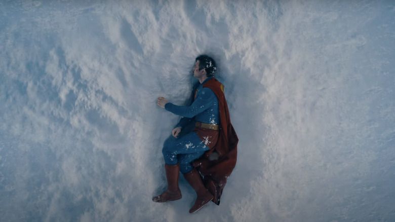 Superman lays in the snow in Superman