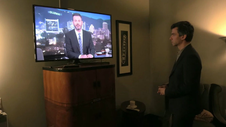 Nathan Fielder watching Jimmy Kimmel on a TV in Nathan For You 