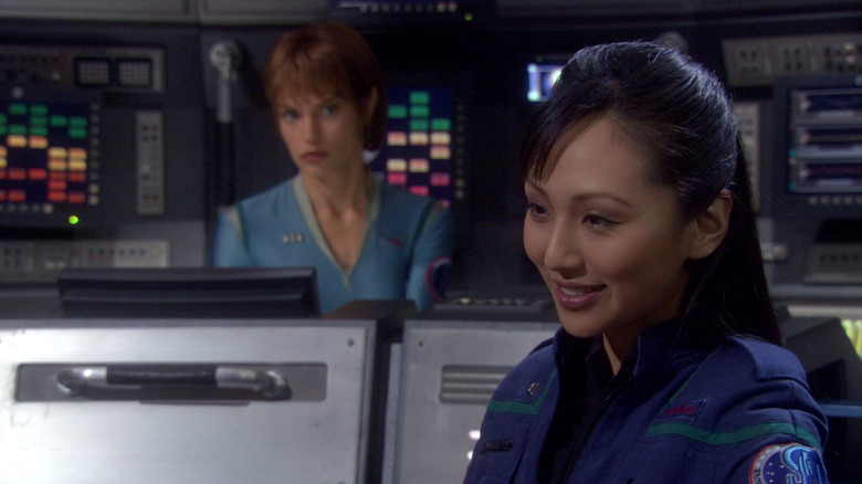 Linda Park as Hoshi Sato on the bridge of the Enterprise on Star Trek: Enterprise, T'Pol sits behind her