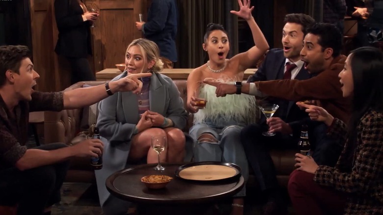 The cast of "How I Met Your Father" excitedly pointing