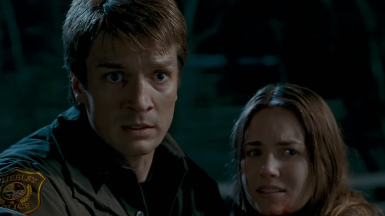 Nathan Fillion and Tania Saulnier in Slither