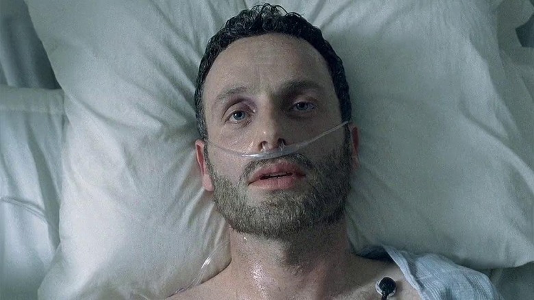 Andrew Lincoln as Rick Grimes waking up in his hospital bed from his coma in The Walking Dead episode Days Gone Bye