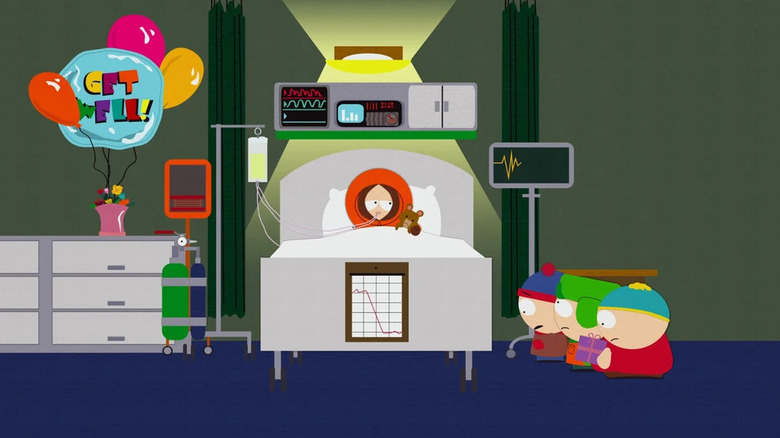 Kenny di tempat tidur sekarat, dikunjungi oleh Stan, Kyle, dan Cartman 