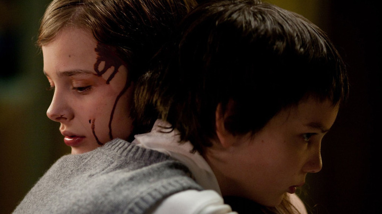 Abby and Owen hug in Let Me In