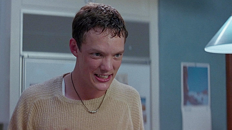 Matthew Lillard as Stu Macher grins maliciously in Scream (1996)