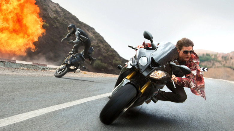 Ethan Hunt takes a sharp turn around an explosion in Mission: Impossible - Rogue Nation