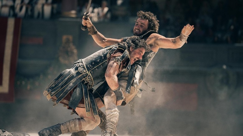 Marcus (Pedro Pascal) tackles Lucius (Paul Mescal) in Gladiator II