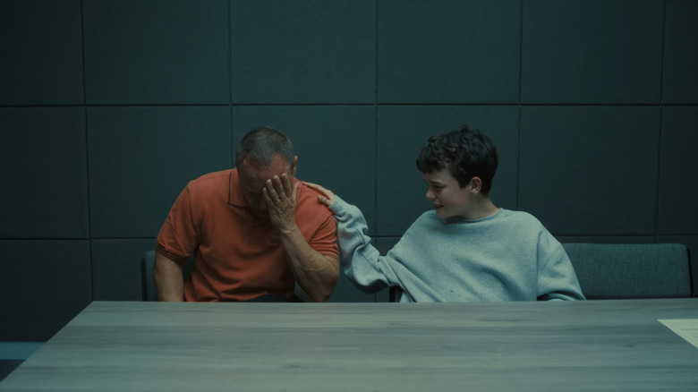 Eddie cries next to his son Jimmy in adolescence