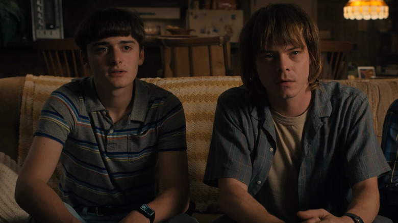 Noah Schnapp Charlie Heaton sitting on couch Stranger Things