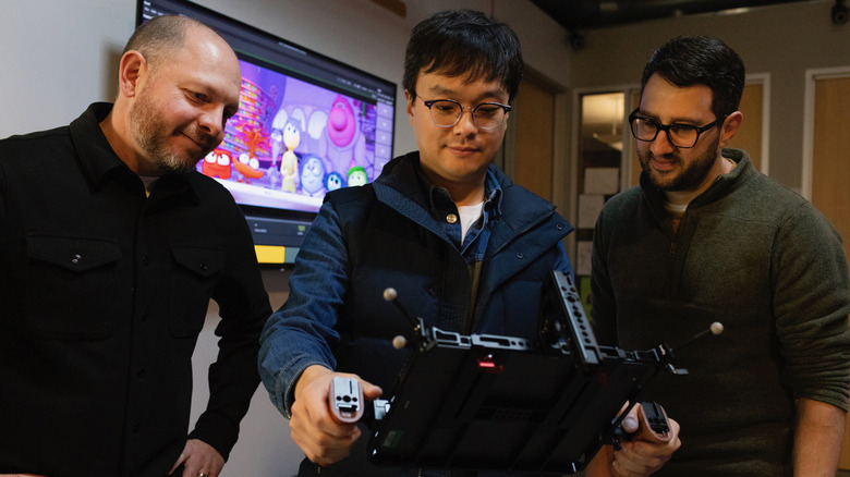 Ryan Heuett, Sunguk Chun and Adam Habib with a virtual camera rig at Pixar Animation