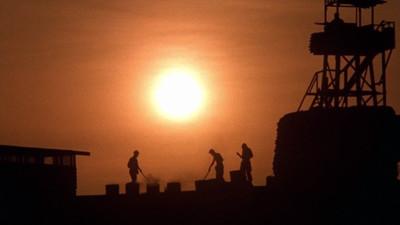 Platoon soliders patrol walls