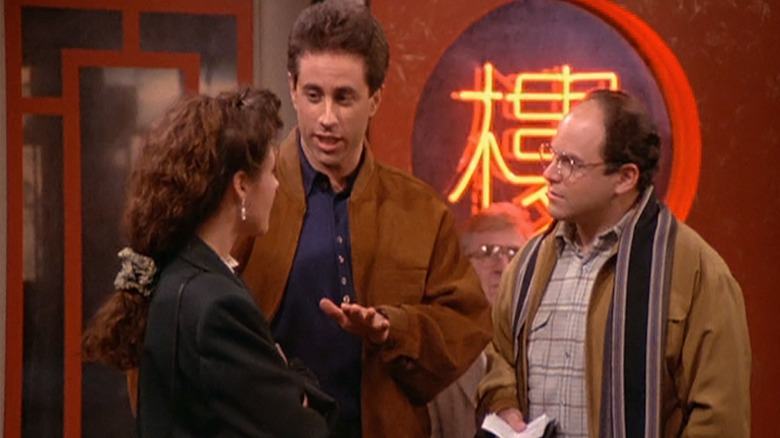 Jerry (Jerry Seinfeld), Elaine (Julia Louis-Dreyfus) and George (Jason Alexander) in wait for a table in the Chinese Restaurant episode of Seinfeld