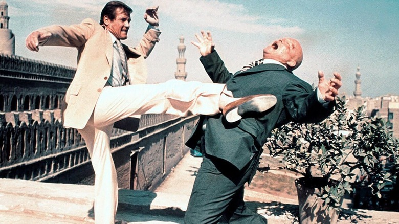 Roger Moore bond kicking guy off building in spy who loved me