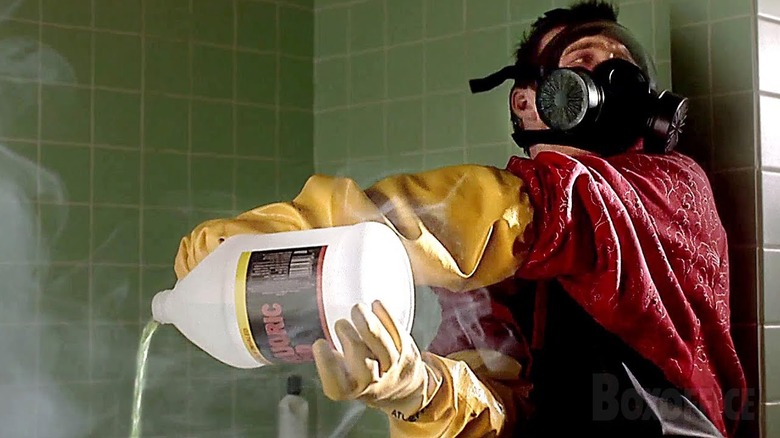 Aaron Paul as Jesse Pinkman pouring acid into a tub on Breaking Bad