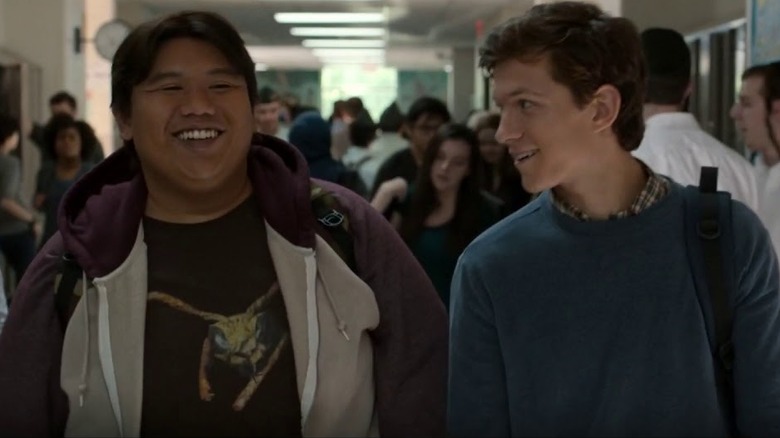 Ned Leeds and Peter Parker smiling in a hallway