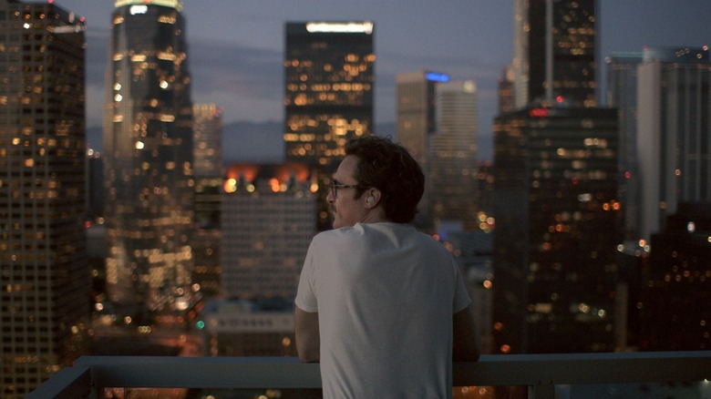 Joaquin Phoenix on the balcony in Her