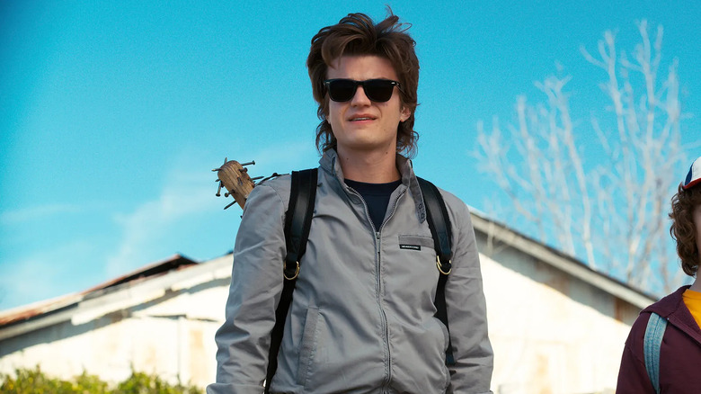 Joe Keery in "Stranger Things" with backpack and bat with nails