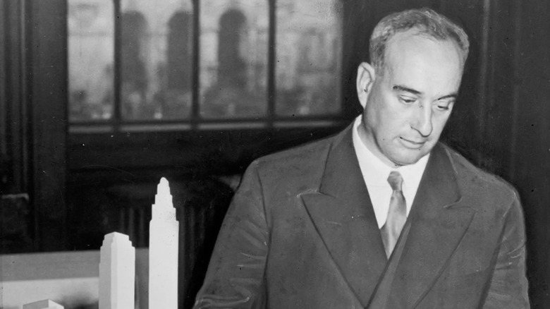 Black and white picture of Robert Moses in a suit and hat