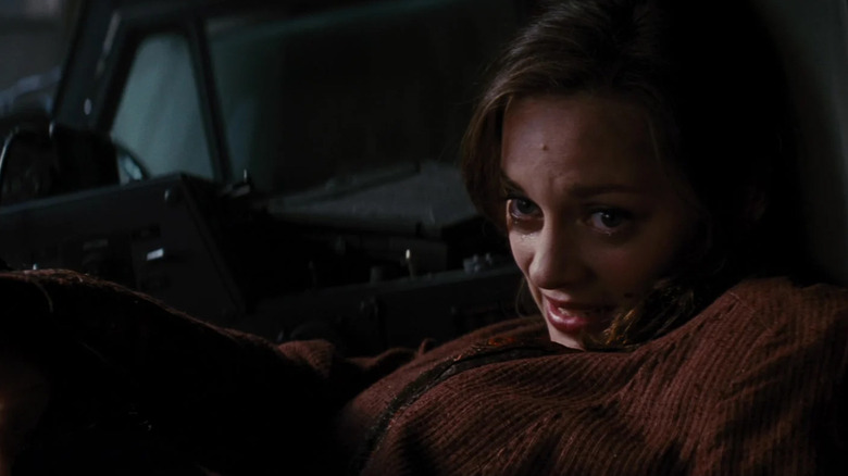 Miranda Tate/Waal al -ly -lying Marion Kotillard sits in the front seat of the truck in the dark knights that rise