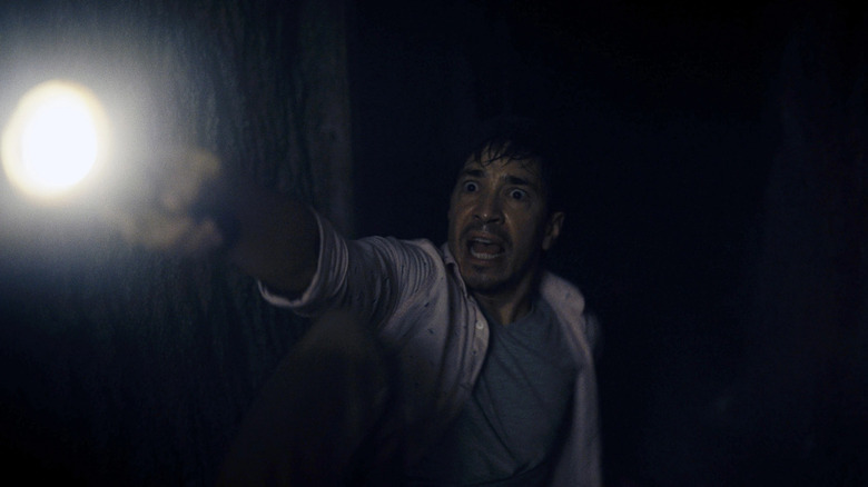 Barbarian justin long with flashlight