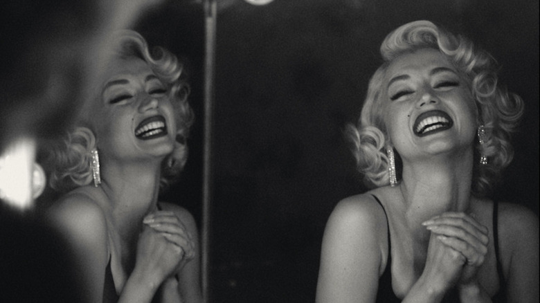 Blonde marilyn smiling in mirror