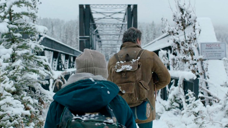 Joel and Ellie walking in the snow